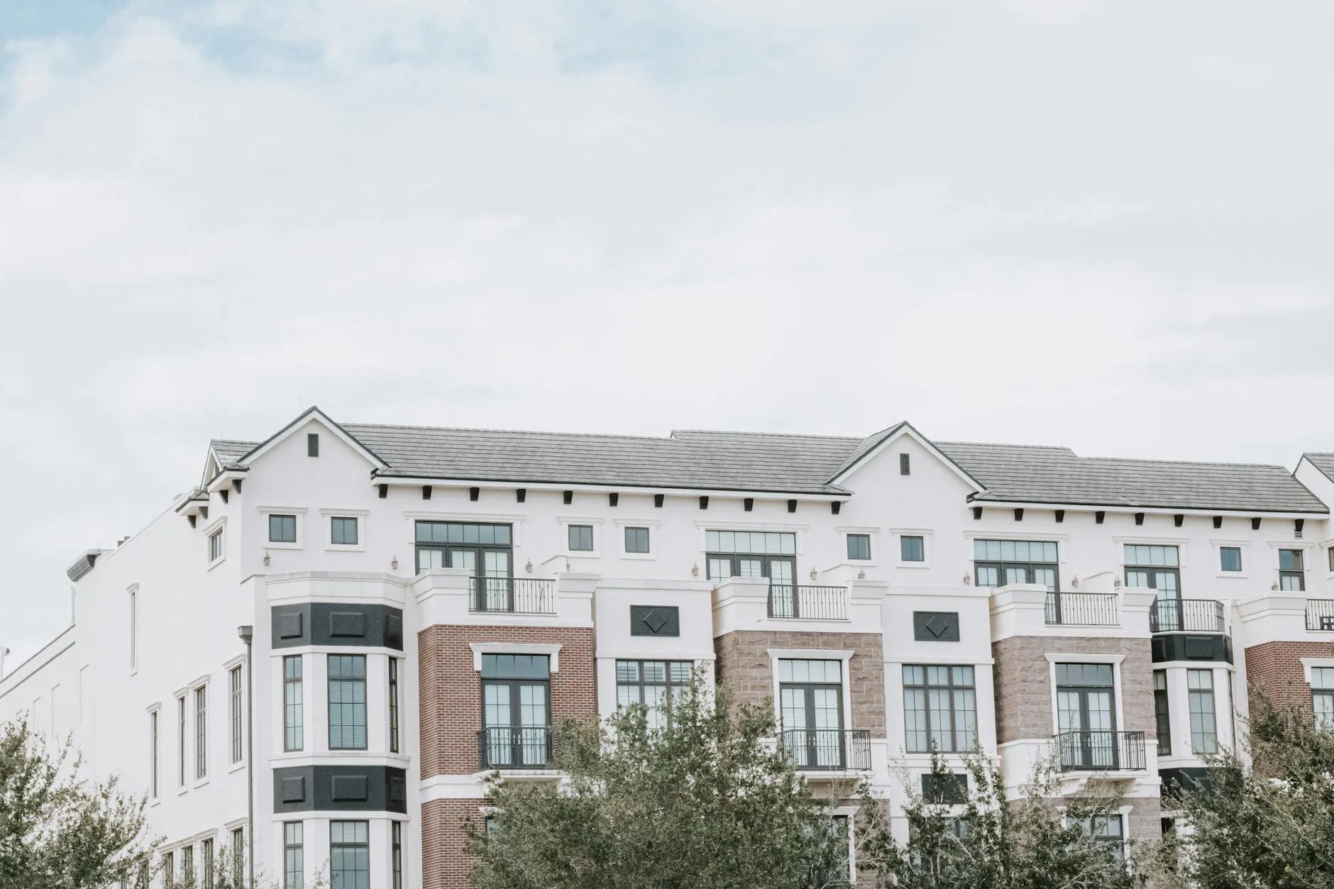 A modern luxury apartment building with clean architectural lines